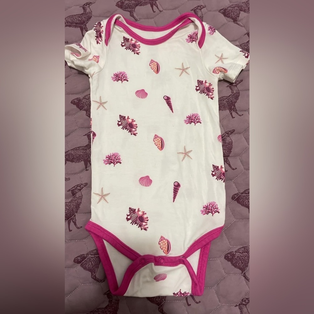 Kyte Baby body suit in “shell” pattern.  EUC.